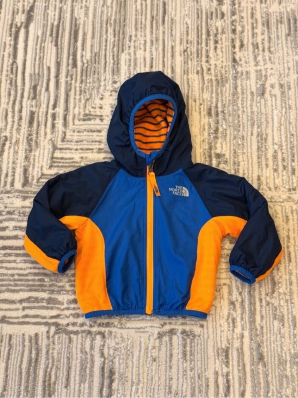 The North Face kids size 6-12 months (Unisex) blue/orange Reversible fleece coat